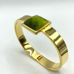 Clamper Style Bracelet Gold Tone with Peridot colored Square Acrylic Stone.
